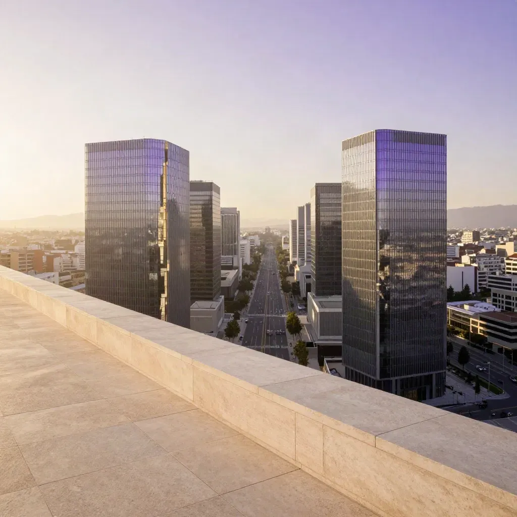 Torres de cristal de Madrid Norte vistas desde una terraza alta al atardecer, con bruma dorada.